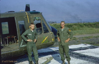 WO1 Robertson and SP4 Harrison
John Keller Photo

UH-1D # 64-13740, 15th RC pad, Golf Course.

Left to right: WO1 William Robertson and SP4/CE Dan "Harry" Harrison, September 1966

From Chuck Stevens CE: "the pic of a/c #64-13740 and WO1 Robertson and Dan Harrison, that was my a/c and Dan was my replacement. pic must have been taken right after I left country."

