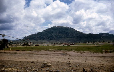 Golf Course heli-port
Ed Lemp Photo: "E" Btry (Avn) 82nd Arty
Golf Course heli-port, Hon Cong mountain with Cav patch in background 6/66

With permission from Ed Lemp
     http://edlempsvietnampicturepages1965-1966.com/

