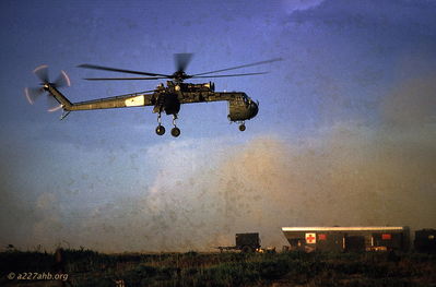 Flying Crane, An Khe
Photo by Marvin Wolf, PIO photographer, 1CAV

Showing people pod on the ground
