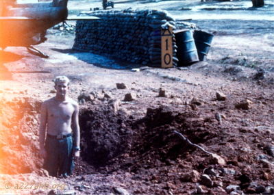 John Woods in 122mm Rocket Crater
John Woods Photo

Camp Evans Ammo Dump Explosion
May 19 - 20, 1968
