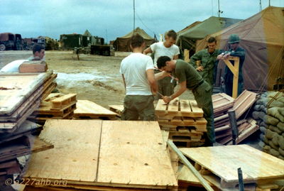 Lt Tornillo and crew
Jay Dirnberger Photo

Breaking up Pallets for the frame of the new shower. Spring 1968
