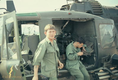 Marty Gilbert, Crew Chief, facing the camera and gunner
Bob Kelly Photo

Marty Gilbert identified by Rickey McKay,  D/227. Camp Evans. 

Just back from a mission and preparing for next.

