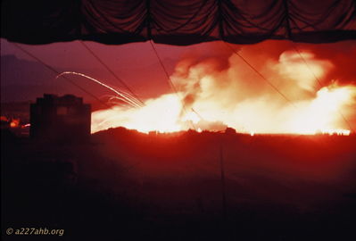 Ammo Dump Explosion May 19th, 1968
Bob Kelly Photo

This is a photo of the ammo dump explosion, May 19th, 1968 (Ho Chi Minh's Birthday) at Camp Evans. The photo looks across the D/227 flight line into the Battalion area.

