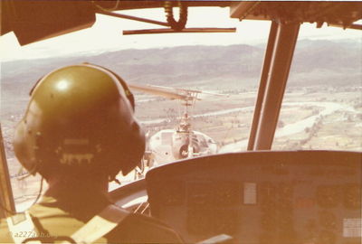 Formation flight from Camp Holloway over the Red Ball near Kontum.
Terry Moore Photo

Formation flight from Camp Holloway over the Red Ball near Kontum looking out from 749.
Aircraft Commander appears to be Mike Jett

