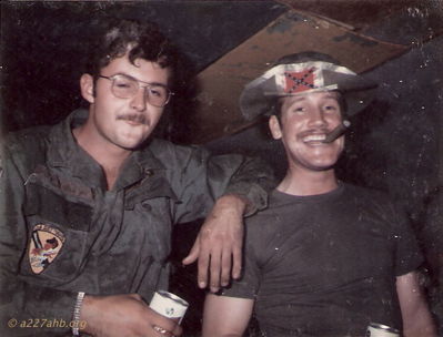 Terry Moore and Dennis Wheatley
Terry Moore Photo

Some shots of the going home party for Crash held in the first flight platoon hooch Camp Holloway June or July 1971.

