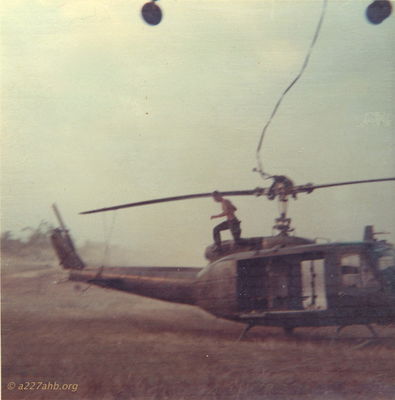 Sling Load Hooked
Steve Chrisman Photo

That would be me jumping off the Huey (66-16806) after hooking the load.
