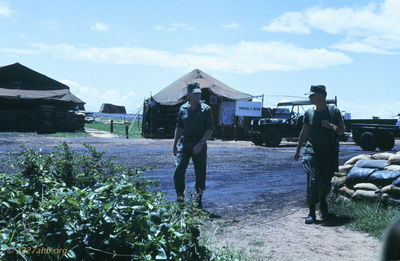 LZ Bird orderly room in the background. Dick Fleck & Les Klan. '67 
JP Edwards Photo
