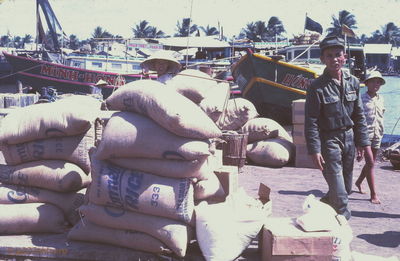  Phan Thiet down town fishing port area; note soldier following us. '67 
JP Edwards Photo
