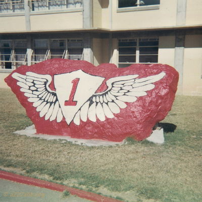 First WOC Rock
Bob Kelly Photo

Class 67-3 found the rock, moved it and painted it. After we graduated the rock was "stolen" and repainted by each succeeding class. The "Wing Rock" remained at Fort Wolters many years after the fort closed. Eventually it was moved to Fort Rucker where it remains today.
