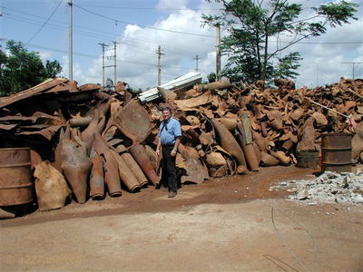 Norm at Scrap Yard at Khe Sanh City
Doc McBride Photo

Modern Day Khe Sanh

From Bob Witt. "Doc Mcbride, Mike Sprayberry's medic at LZ Tiger, took these pictures on his return trip to Vietnam. He returned the A Shau to look for his unit's MIA's lost at Tiger. Doc fortunately survived serious wounds received on the road below Tiger on April 25, 1968. Mike Sprayberry received the MOH for going out that night to rescue Doc & the rest of his patrol. Their unit was on board for the first Combat Assault's into LZ Tiger."
