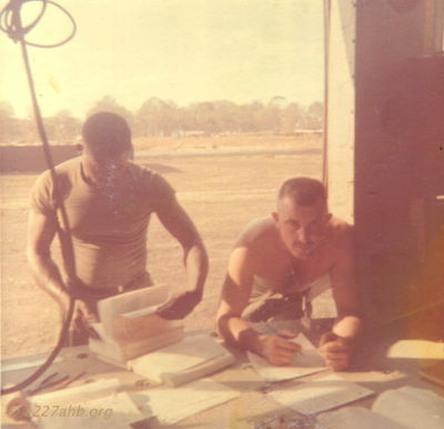 PK and SSG Smith
Randy Hankins Photo

PK and SSG Smith, my Platoon Sergeant. PK had just started his moustache when this was taken.
Lai Khe, 1968 - 1970
