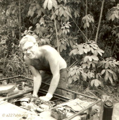 Motor Pool (Need help with name)
David Priest Photo

Lai Khe 1969
Can anyone help with first names or home towns?
From Ed Sanford;  "He was the generator man. I think he was from Wisconsin. His last name was pronounced like Rickey but may not have been spelled that way."

