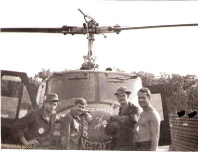 Crash's Mistakes 523
Terry Moore Photo

Crash's Mistakes 523 From left to right, LaFrancouis (Frenchie) door gunner, Mr. Brooks (right seater) Ozark Joe (Terry Moore) Crew Chief holding cat and Crash (Dennis Wheatley) aircraft commander.
Picture was taken as we were departing Lai Khe for the last time to regroup at Camp Holloway.
I was also known as Willie Boy some of the time.

Keywords: nose art