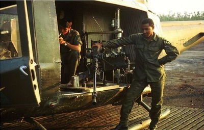 You all remember these missions? This is getting 046 and the 50 ready for a night mission. 
Crew member inside identified as Wes Yost by Tom Rinehart.  Likely Joe Leonard standing outside

Larry Hirschi Photo
AKA "ChickenMan 109"
Lai Khe 
