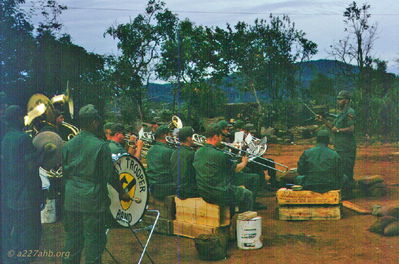 1CAV Band playing at LZ Oasis
John Keller Photo

1CAV Band at LZ Oasis on Thanksgiving 1966 at the A/227 Company area.
