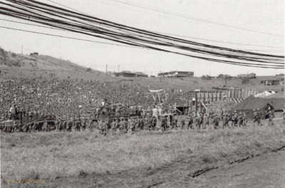 Filing into Christmas Show
John Keller Photo

View of U.S. Military Troops filing into the 4th ID's "Ivy Bowl" at Pleiku to view the USA's, Bob Hope Christmas Show.

