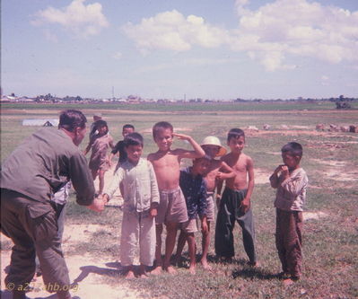 Jack Bouska giving kids candy at Thien Gao
Bob Kelly Photo
