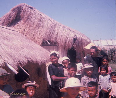 Visiting 
Bob Kelly Photo

I was honored to be allowed to visit inside the home at rear. Very neat and organized. Sleeping mats rolled up and put up. Clean dirt floor. Cooking items. Cooking area. I was very careful in asking permission using hand signs and some English. I believe they understood I was trying to better understand their culture.
