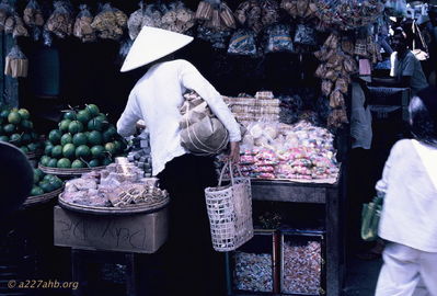 Stall in Phan Thiet market
Bob Kelly Photo

Nice stall in the Phan Thiet Market. Green cabbage type heads and candy? Sweet rolls in front.
