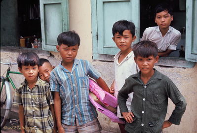 Kids in Phan Thiet market
Bob Kelly Photo

Kids carrying some black enamel paintings I purchased, wrapped in purple tissue.

