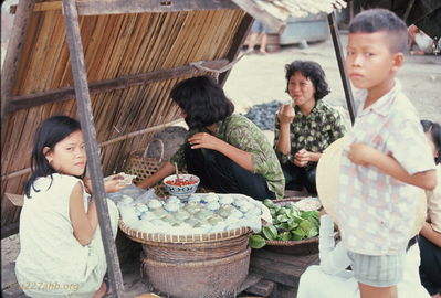 Selling pottery under bamboo lean-to
Bob Kelly Photo

Ladies selling pottery under bamboo lean-to. Are those beetle nut leaves? Red sauce in bowl?

