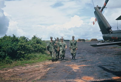 Two Unknowns at Phan Thiet
Tom Loughlin Photo

Two identified by Dennis Burden: "Walking next to huey is George Lenot - to his right is Martin - other two???"

