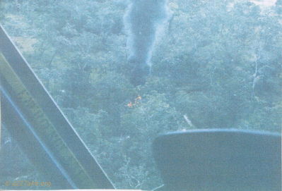 Fire after the explosion
Pat Edwards Photo

Note the creek visible over the dashboard. This is the creek bed we took cover in. We were up the creek closer to the fire.


