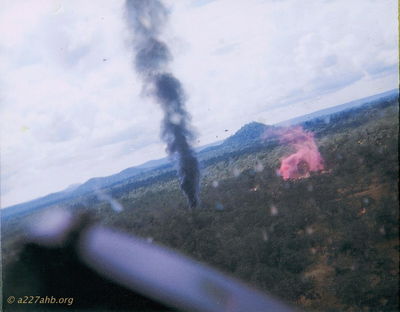 Still Burning
John LaDue Photo

Someone, either 1/9th Scouts or the C&C ship threw red smoke.

