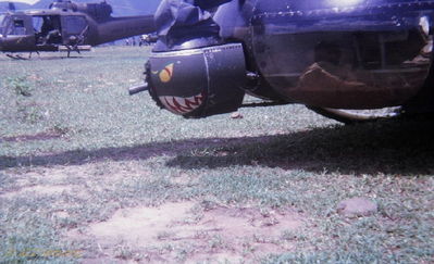 Frog
John LaDue Photo


The picture shows two UH-1C gunships flown by 1st Plt. D/227th, 1st Air Cav, out of Phan Thiet. The ship in the foreground is armed with a "Thumper". It is a belt fed 40mm grenade launcher. The pod is controlled by the pilot in the left seat and traverses vertically and horizontally. It fired about 60(?) rds. per min. It was also armed with 14, 2.75 rockets, on fixed mounts, that were fired by the right seat pilot. The ship in the background was armed with a mini-gun system and rockets. 
