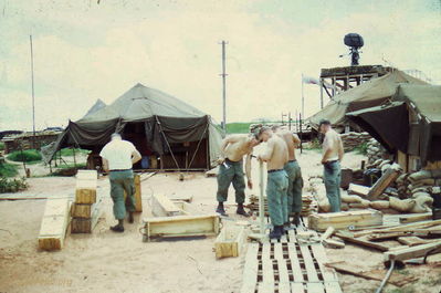 New Shower Construction
Jim Puhala Photo

Phan Thiet
New shower construction begins with breaking up ammo boxes for lumber.
Left to Right: WO Hosmun, SP5 Hall, WO Bond, unknown, SFC Best.
