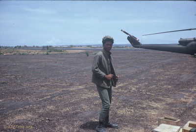 Mixed Race Vietnamese Teen
Jim Puhala Photo


A 16 year old Vietnamese/Black teen (means he would have been born in 1951.)
This photo was taken at Song Mau. We spent a lot of time there - waiting. Weâ€™d put out a recon patrol in the morning. Theyâ€™d recon for a while; if they didnâ€™t find anything, weâ€™d pick them up and put them someplace else. If they did find something, weâ€™d do a CA.

