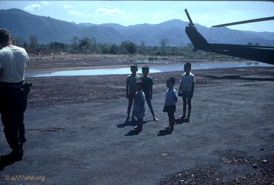 Another group of kids
Jim Puhala Photo

Helicopters, at least the guns, were kid magnets.
This photo was taken at Song Mau. We spent a lot of time there - waiting. Weâ€™d put out a recon patrol in the morning. Theyâ€™d recon for a while; if they didnâ€™t find anything, weâ€™d pick them up and put them someplace else. If they did find something, weâ€™d do a CA.


