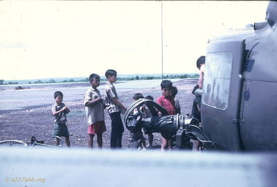 Kids with bikes
Jim Puhala Photo

Helicopters, at least the guns, were kid magnets.
This photo was taken at Song Mau. We spent a lot of time there - waiting. Weâ€™d put out a recon patrol in the morning. Theyâ€™d recon for a while; if they didnâ€™t find anything, weâ€™d pick them up and put them someplace else. If they did find something, weâ€™d do a CA.


