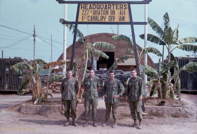 227th Battalion Headquarters at Phouc Vinh
Bob Witt Photo

Headquarters sign in front of the commanding officers quonset at Phouc Vinh - spring of 1969
Nick Johnson second from left with OPS guys.
