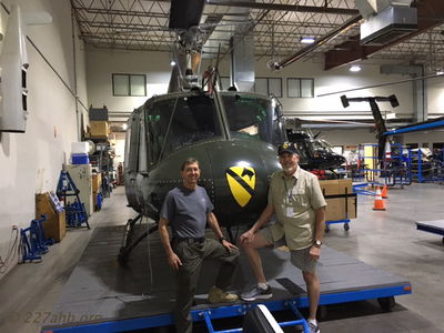 Greg Aguirre and John Keller at Dillon Aero
John Keller Photo
On his way home from our 2017 reunion John Keller met up with Ralph (Greg) Aguirre (A/227, 1969-1970) at Dillon Aero facility at the Scottsdale Airport. UH-1H is 68-16056 used as test bed for their gun systems.
Greg says,"I feel blessed to still be flying a H Model Huey. It seems like a time-machine each time I strap in."
