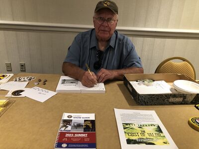 Bob Witt signing his new book (War and Police)
Lillian Burbank Photo
