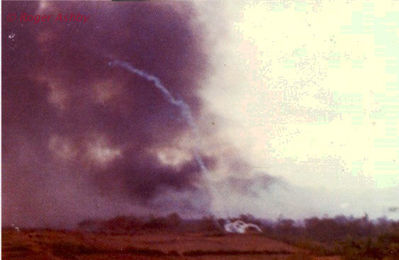 LZ English Ammo Dump Explosion
"It stared at about 3 AM until around 10AM. The over head explosion knocked a portion of the tent down the 105 round fraction of that shell created a heavy dust storm in the bunker."

Roger Ashby Photo
