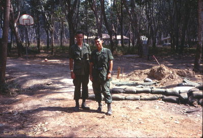 Unknown at Lai Khe
Wayne Trucke Photo

1969

I don't remember their names (can anyone help?), but I believe these are the two pilots, Yellow One, who received the Silver Star for going into a hot LZ five or more times. They had a least three ships shot up, but would not let any of the other pilots go in. They just traded ships. 
