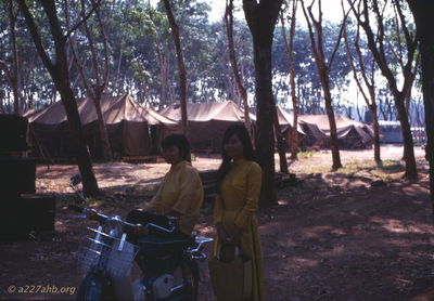 Two locals in our first company area
Wayne Trucke Photo

 1969  Lai kHe

I believe they were some of the laundry gals. Tents with a wooden floor in background. 
