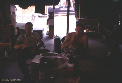 Unknown and I believe Lt. Murphy?? -  relaxing in tent at Lai Khe 
Wayne Trucke Photo

1969

